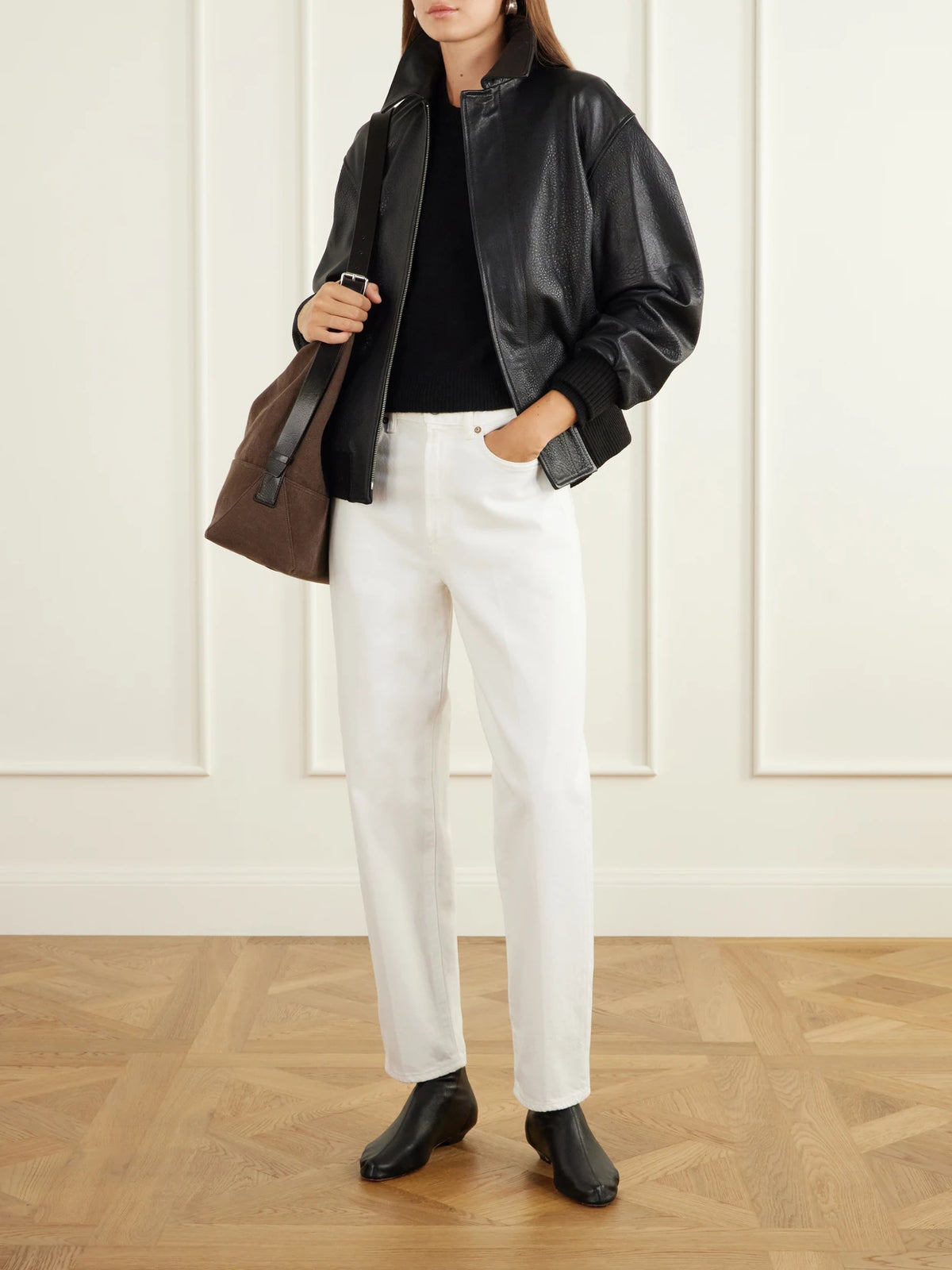 Image of Coats & Jackets. Product name - Toyen Leather Bomber Jacket in Black colour by brand - Nour Hammour