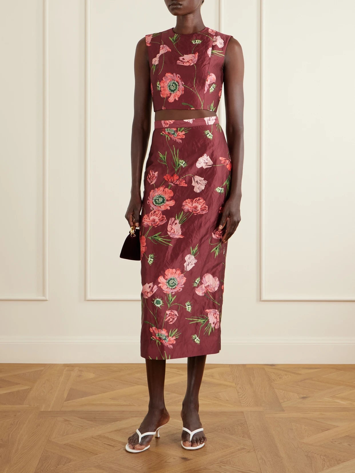 Image of a model wearing Skirts. Product name - Floral-printed Satin Midi Pencil Skirt in Burgundy colour by brand - Erdem
