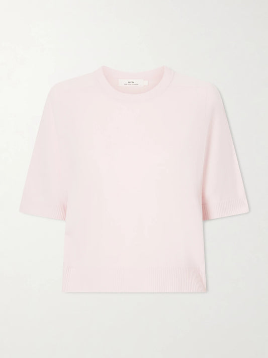 Image of a model wearing Outerwear. Product name - Kai Cashmere Sweater in Pastel pink colour by brand - Arch4