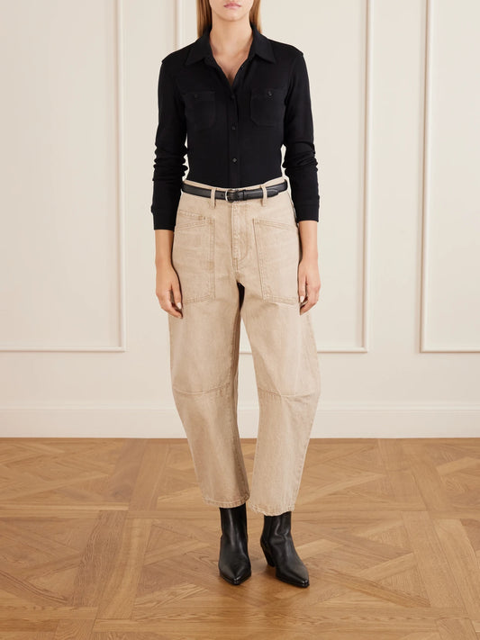 Image of a model wearing Tops. Product name - Ibra Merino Wool Shirt in Black colour by brand - Nili Lotan