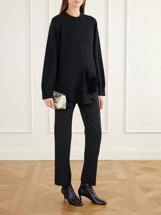 Image of a model wearing Outerwear. Product name - Asymmetric Rib-trimmed Merino Wool, Cashmere And Cotton-blend Sweater in Black colour by brand - TOTEME
