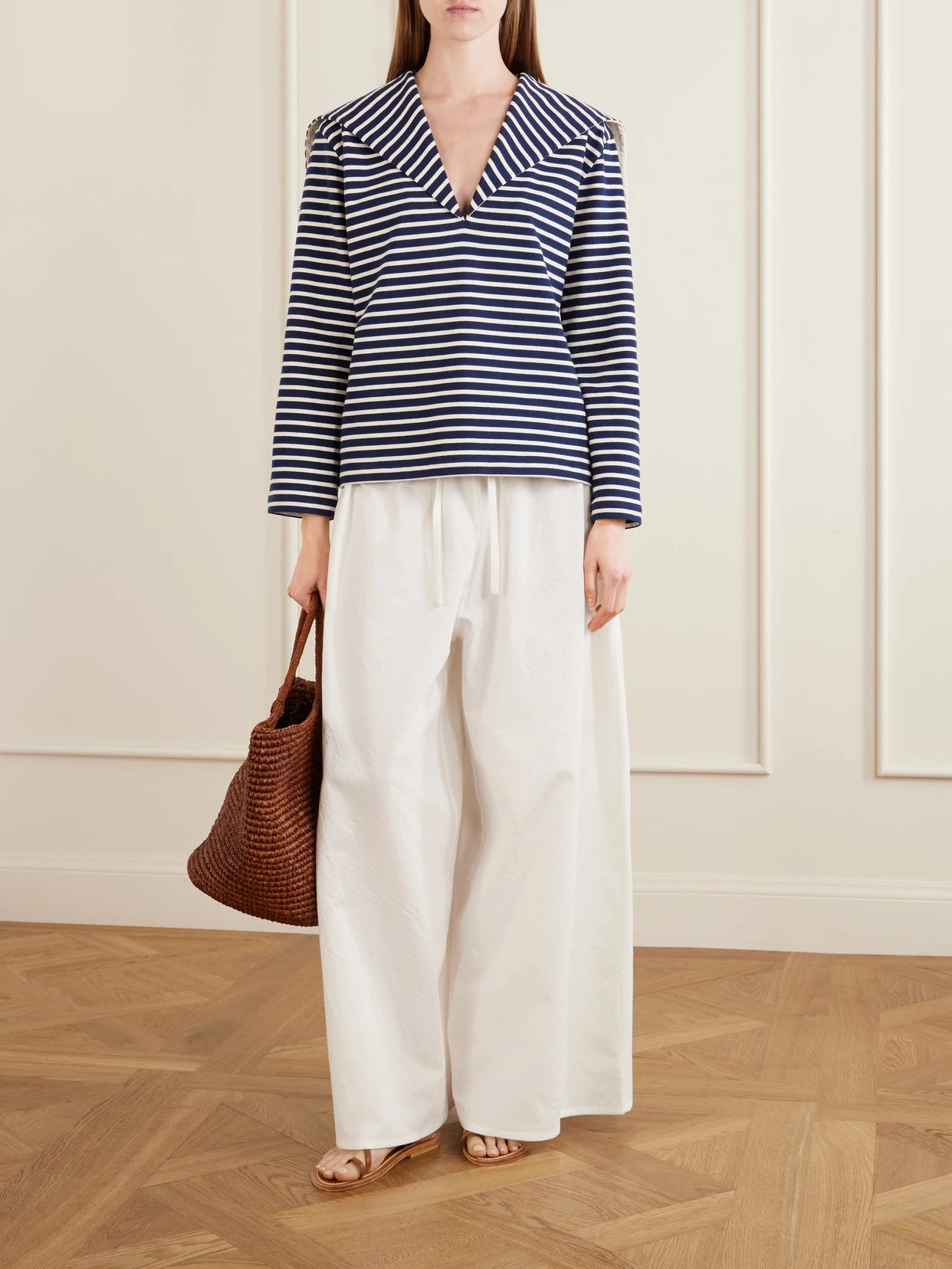 Image of a model wearing Tops. Product name - Seaman Striped Cotton-jersey Blouse in Blue colour by brand - Les Vacances D'Irina