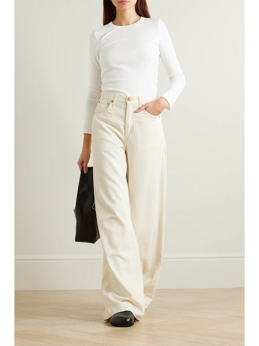 Image of a model wearing Tops. Product name - Kelly Ribbed Stretch-cotton Jersey Top in White colour by brand - LESET
