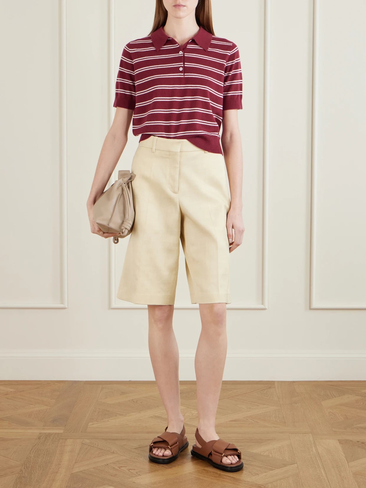 Image of a model wearing Outerwear. Product name - Octavia Cropped Striped Cashmere Polo Shirt in Burgundy colour by brand - Arch4