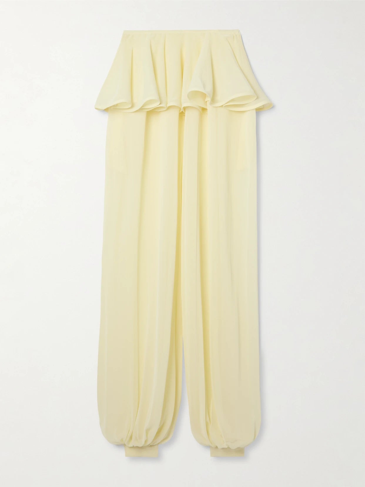 Image of a model wearing Pants. Product name - Pleated Georgette Peplum Balloon Pants in Pastel yellow colour by brand - Alaïa