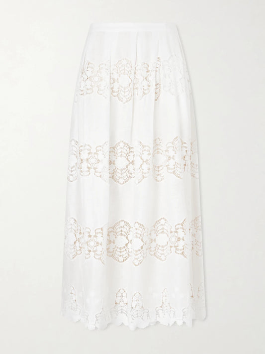 Image of a model wearing Skirts. Product name - Carissa Embroidered Cotton And Linen-blend Midi Skirt in Ivory colour by brand - Miguelina