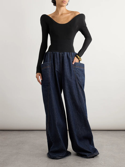 Image of a model wearing Tops. Product name - Open-back Padded Jersey Bodysuit in Black colour by brand - Alaïa