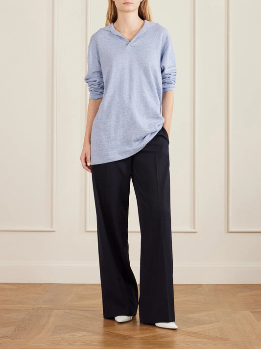 Image of a model wearing Tops. Product name - Niosa Cotton And Linen-blend Polo Shirt in Light blue colour by brand - The Row