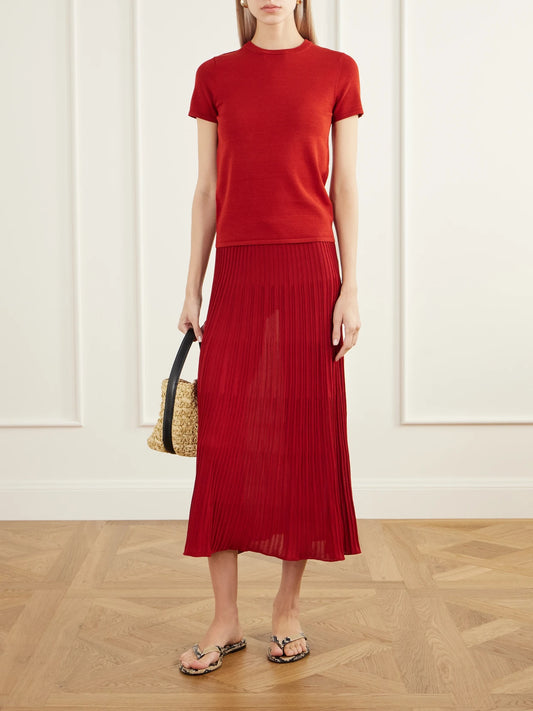 Image of a model wearing Skirts. Product name - Citara Drawstring Ribbed Cotton-blend Knitted Midi Skirt in Red colour by brand - Faithfull