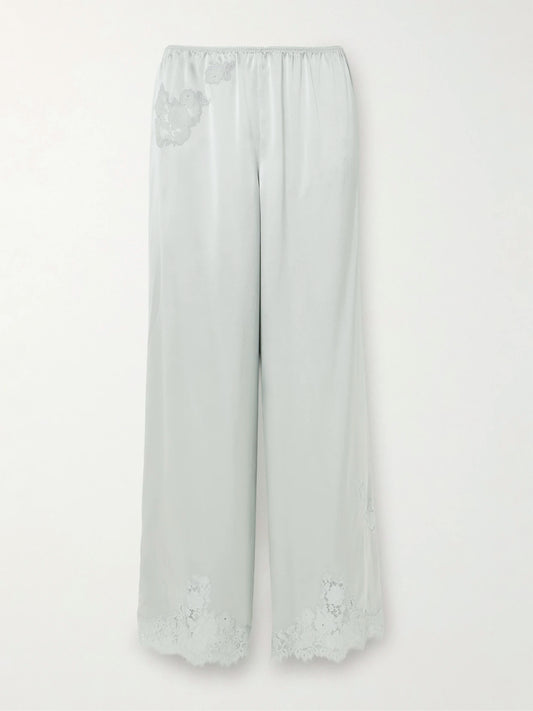 Image of a model wearing Pants. Product name - Lavon Lace-trimmed Silk-satin Wide-leg Pants in Blue colour by brand - DÔEN