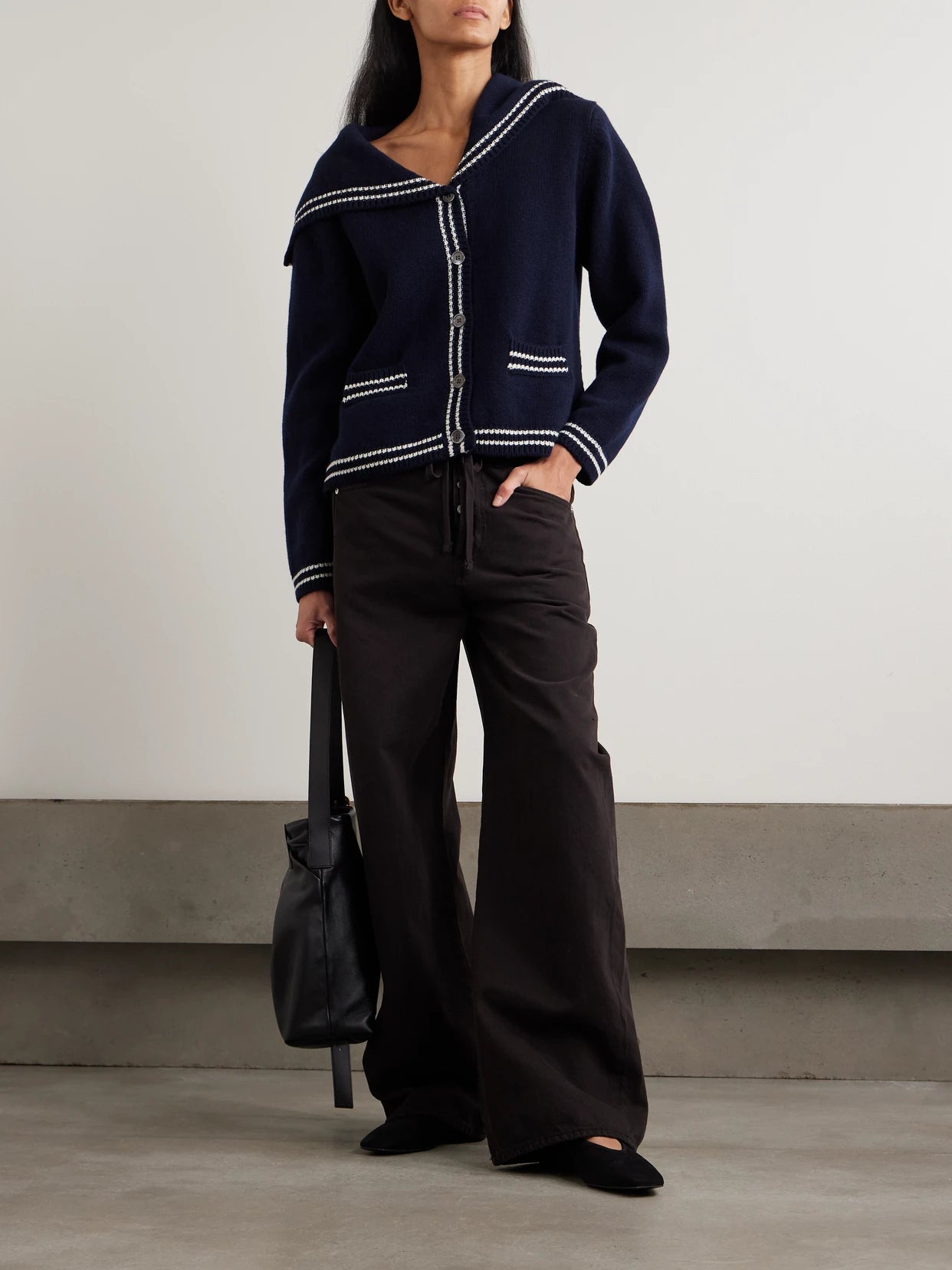 Image of a model wearing Outerwear. Product name - Saoirse Sailor Striped Wool Cardigan in Navy colour by brand - &Daughter