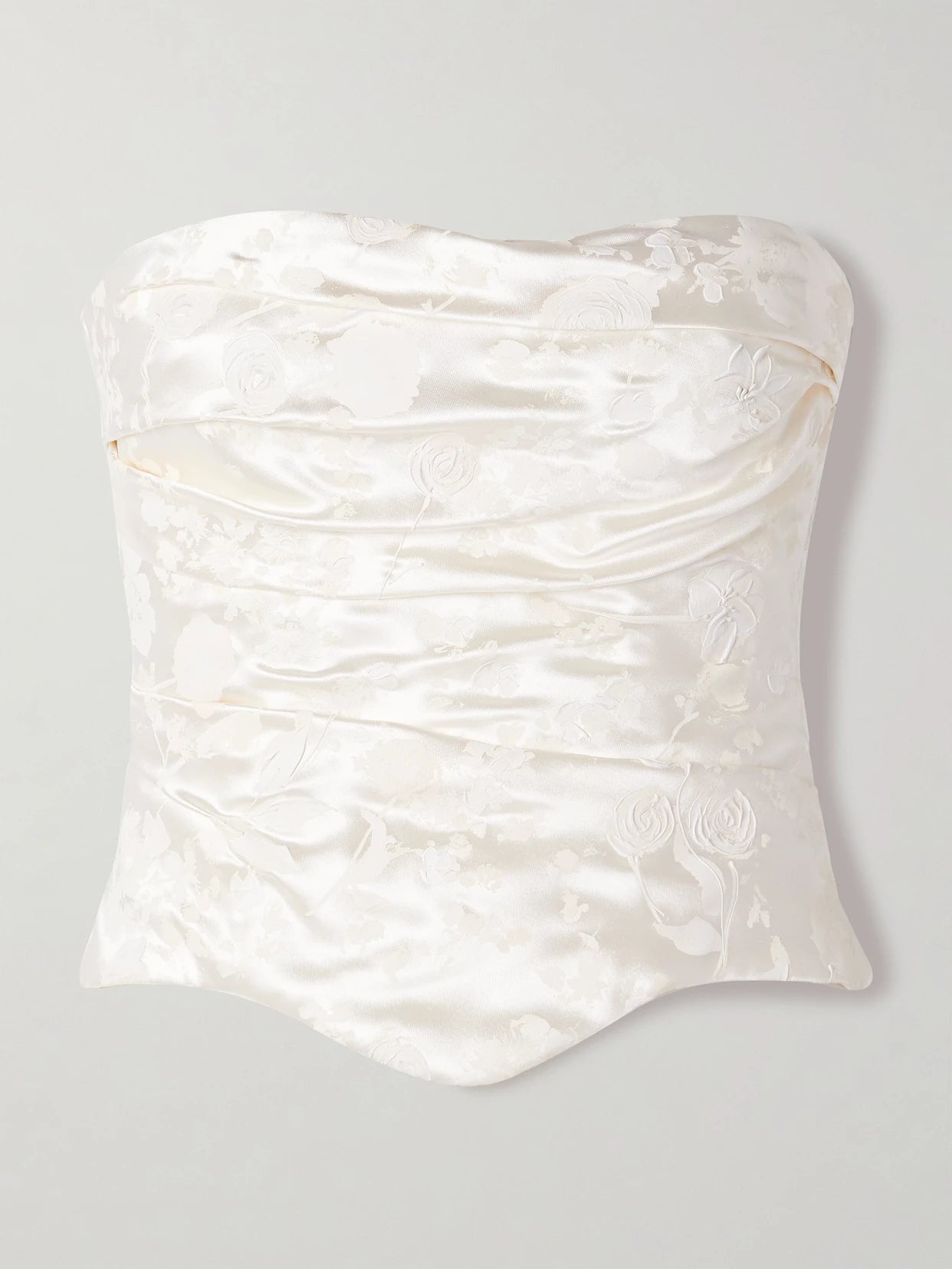 Image of a model wearing Tops. Product name - Demi Strapless Draped Painted Silk And Wool-blend Satin Bustier Top in Off-white colour by brand - Danielle Frankel