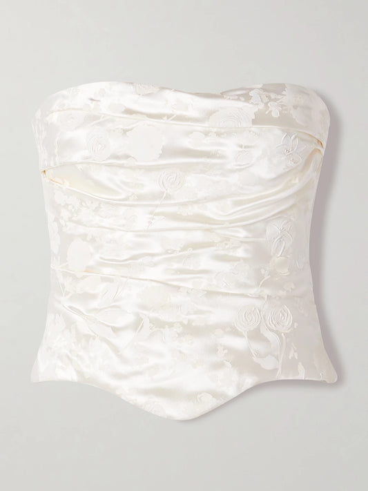 Image of a model wearing Tops. Product name - Demi Strapless Draped Painted Silk And Wool-blend Satin Bustier Top in Off-white colour by brand - Danielle Frankel