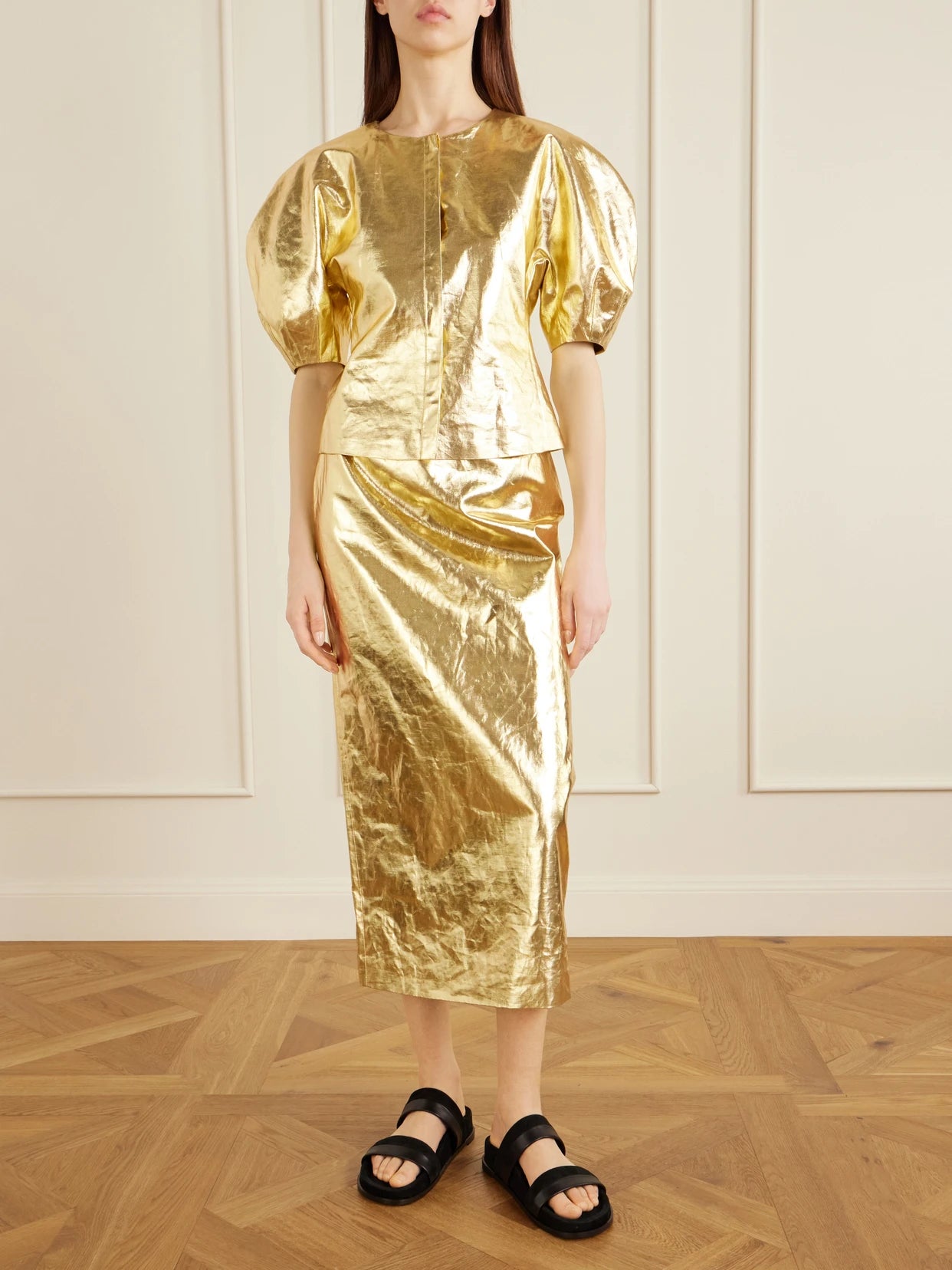 Image of a model wearing Tops. Product name - Waverly Linen Top in Gold colour by brand - Gabriela Hearst