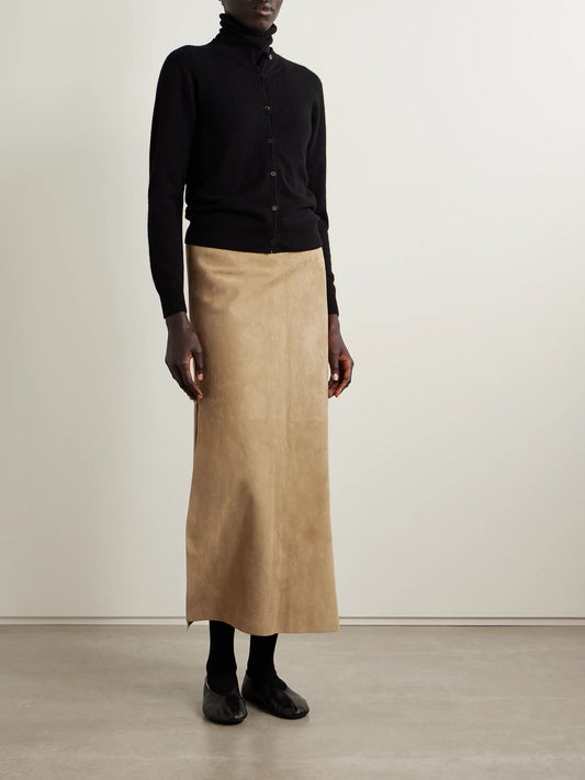Image of a model wearing Skirts. Product name - Danas Paneled Suede Midi Skirt in Beige colour by brand - The Row