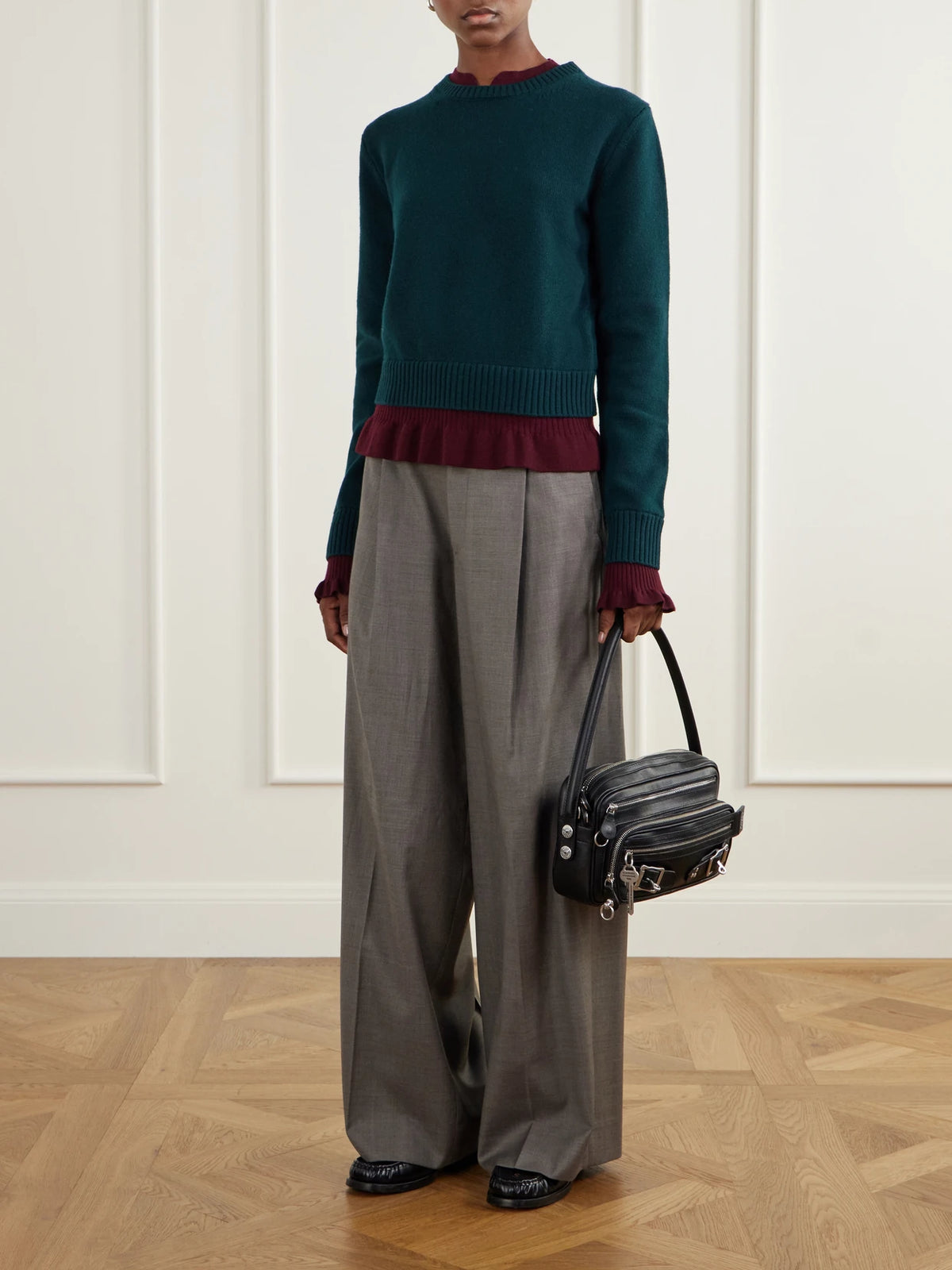 Image of a model wearing Outerwear. Product name - Layered Wool Sweater in Dark green colour by brand - Acne Studios