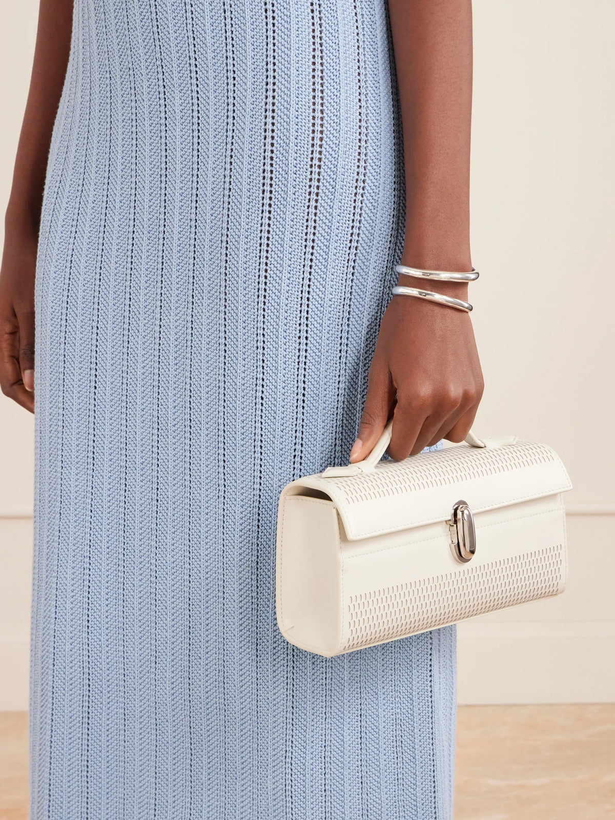 Image of Bags. Product name - Symmetry Laser-cut Leather Clutch in White colour by brand - Savette