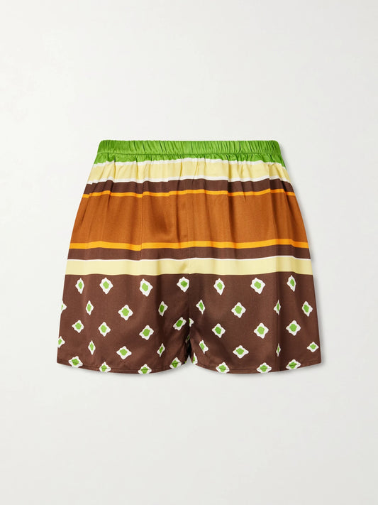 Image of a model wearing Shorts. Product name - Tia Printed Satin Shorts in Brown colour by brand - Faithfull