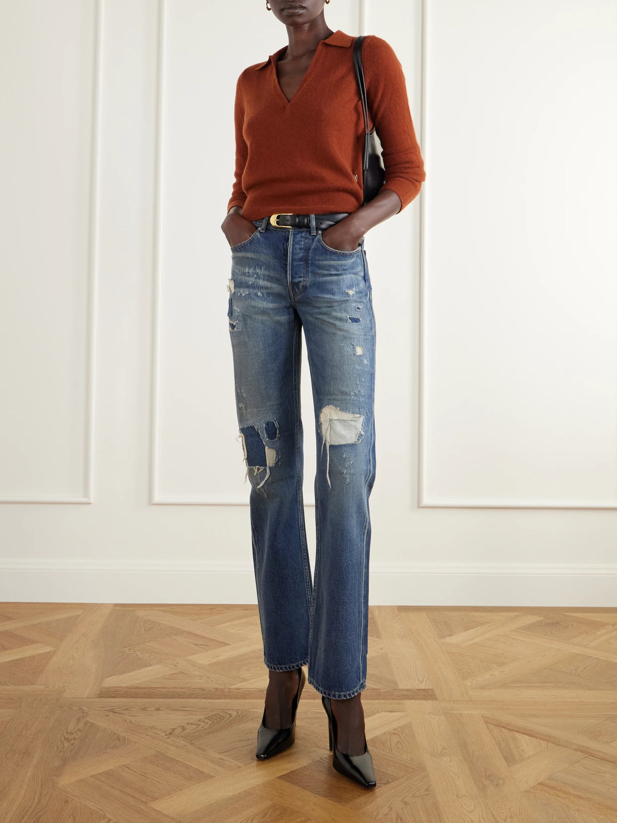 Image of a model wearing Outerwear. Product name - Vance Cashmere Polo Sweater in Red colour by brand - ÉTERNE