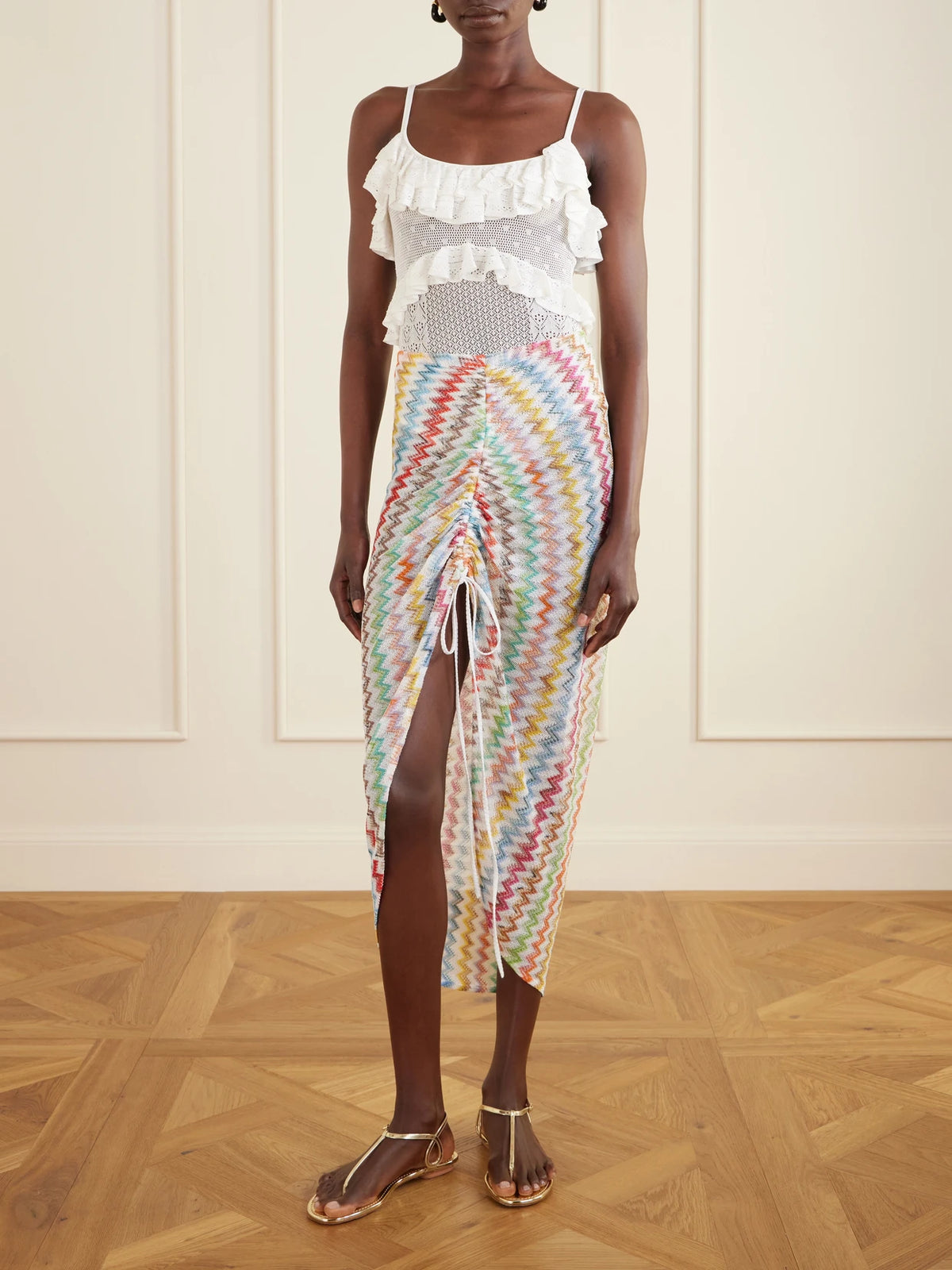 Image of a model wearing Skirts. Product name - Gathered Striped Metallic Crochet-knit Midi Skirt in Blue colour by brand - Missoni