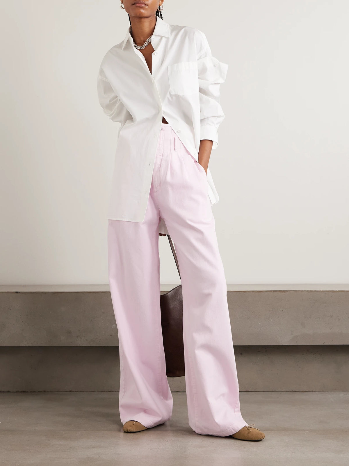 Image of a model wearing Tops. Product name - + Maria Mcmanus Oversized Organic Cotton-poplin Shirt in White colour by brand - AGOLDE