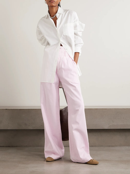 Image of a model wearing Tops. Product name - + Maria Mcmanus Oversized Organic Cotton-poplin Shirt in White colour by brand - AGOLDE