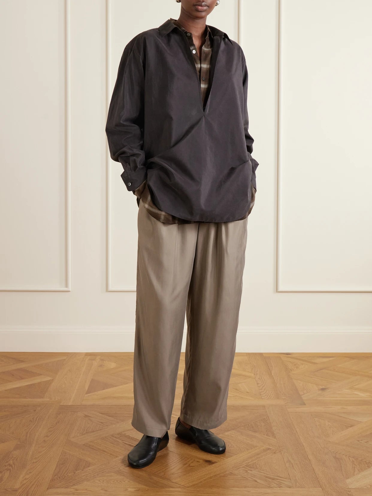 Image of a model wearing Tops. Product name - Skipper Silk-blend Shirt in Charcoal colour by brand - ssstein