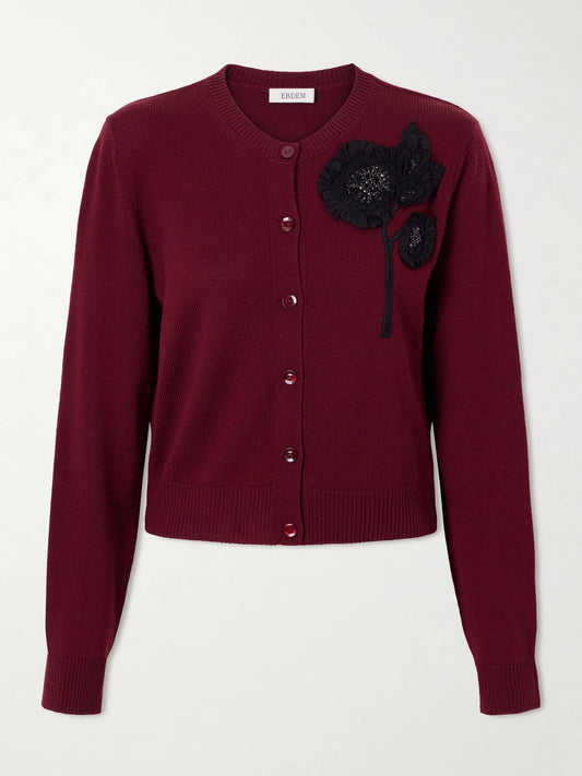 Image of a model wearing Outerwear. Product name - Embellished Ribbed Merino Wool Cardigan in Burgundy colour by brand - Erdem