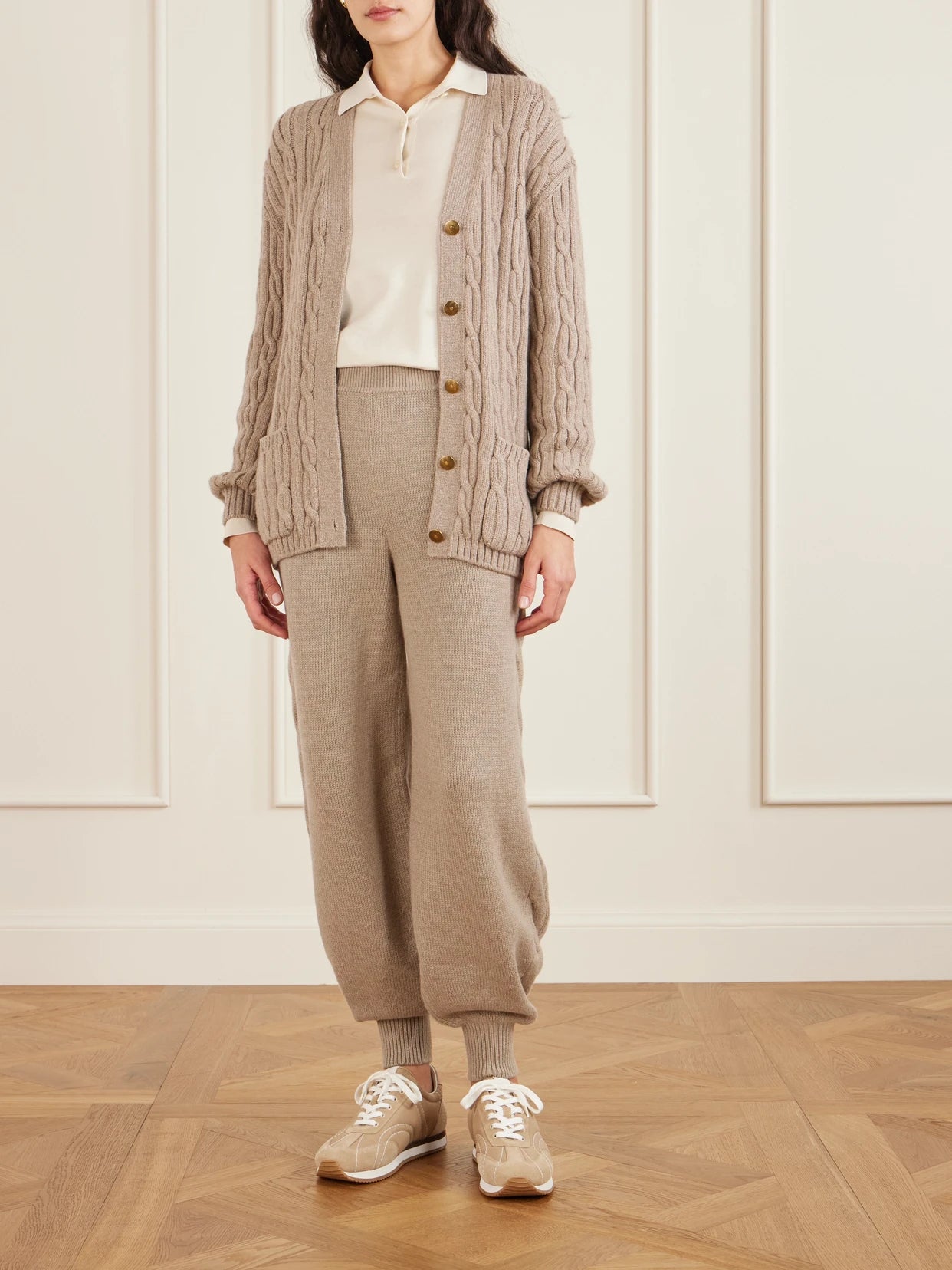 Image of a model wearing Pants. Product name - Cashmere Tapered Pants in Beige colour by brand - Loro Piana