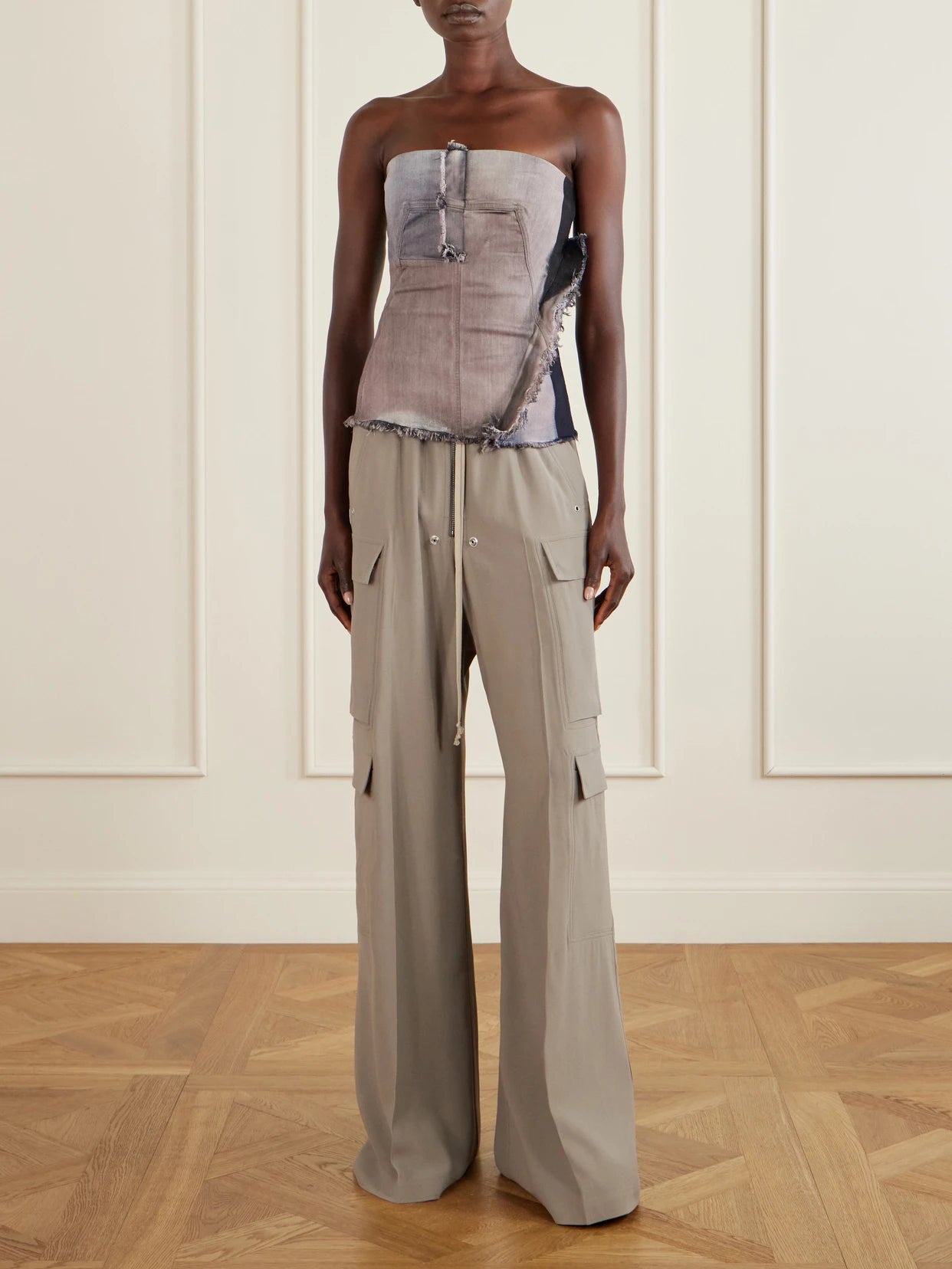 Image of a model wearing Tops. Product name - Frayed Denim Bustier Top in Blush colour by brand - Rick Owens