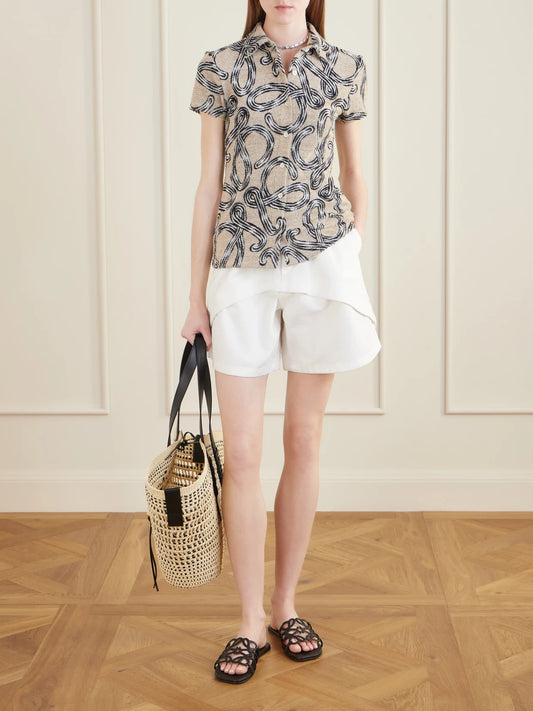 Image of a model wearing Shorts. Product name - +paula's Ibiza Denim Shorts in White colour by brand - LOEWE