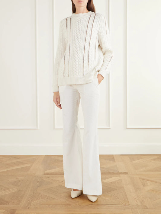 Image of a model wearing Outerwear. Product name - Westal Fisherman-knit Merino Wool And Cashmere-blend Sweater in Ivory colour by brand - Gabriela Hearst