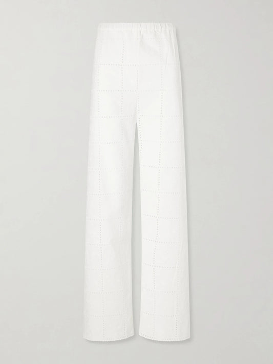 Image of a model wearing Pants. Product name - Mora Broderie Anglaise Straight-leg Pants in White colour by brand - Faithfull