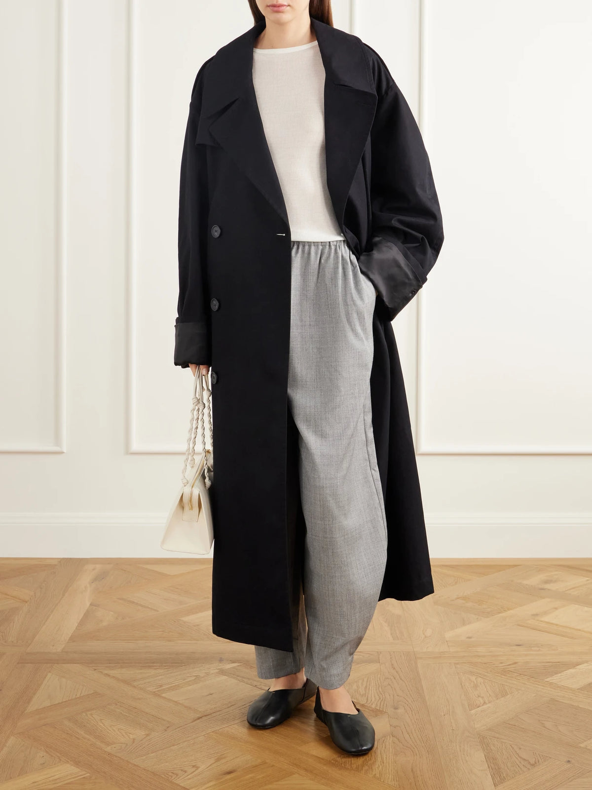 Image of a model wearing Pants. Product name - Wool-blend Woven Barrel-leg Pants in Gray colour by brand - ST. AGNI