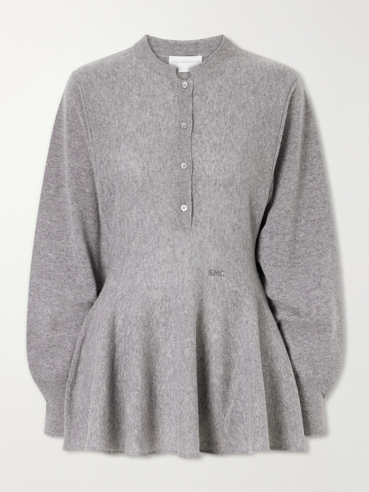 Image of a model wearing Outerwear. Product name - Wool Peplum Sweater in Gray colour by brand - Stella McCartney