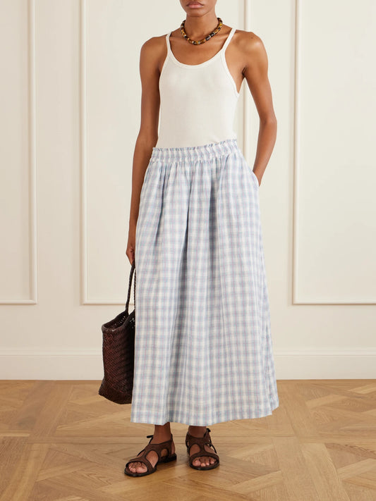 Image of a model wearing Skirts. Product name - Pleated Checked Linen Midi Skirt in Purple colour by brand - SKALL