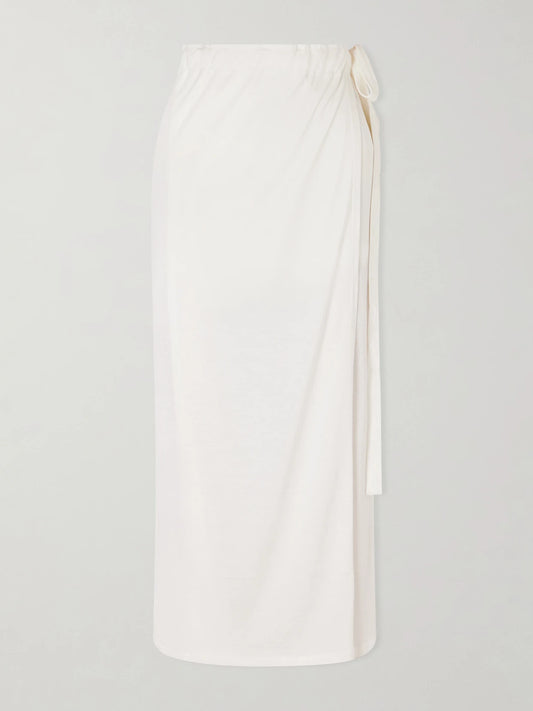 Image of a model wearing Skirts. Product name - Silk And Cotton-blend Wrap Midi Skirt in Off-white colour by brand - TOTEME