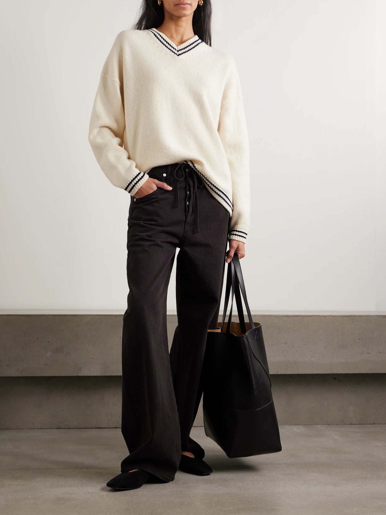 Image of a model wearing Outerwear. Product name - Balla Slouch Striped Wool Sweater in Cream colour by brand - &Daughter