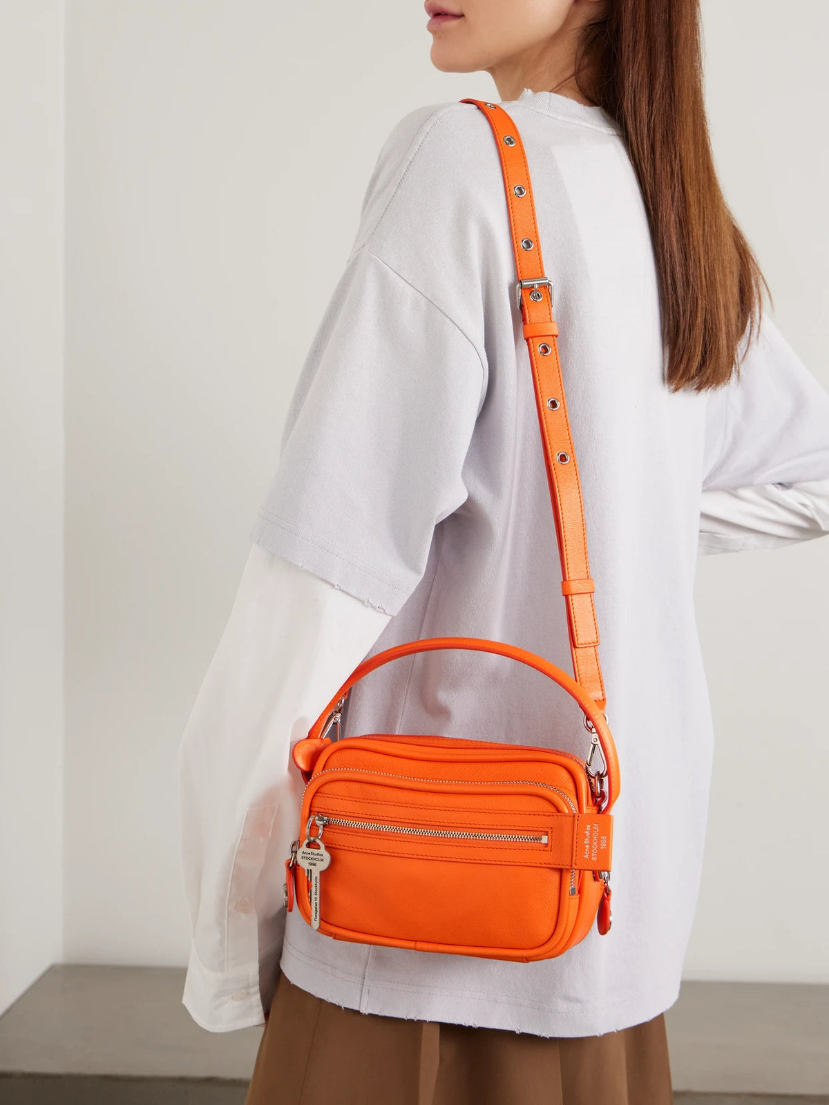 Image of Bags. Product name - Embellished Textured-leather Shoulder Bag in Orange colour by brand - Acne Studios