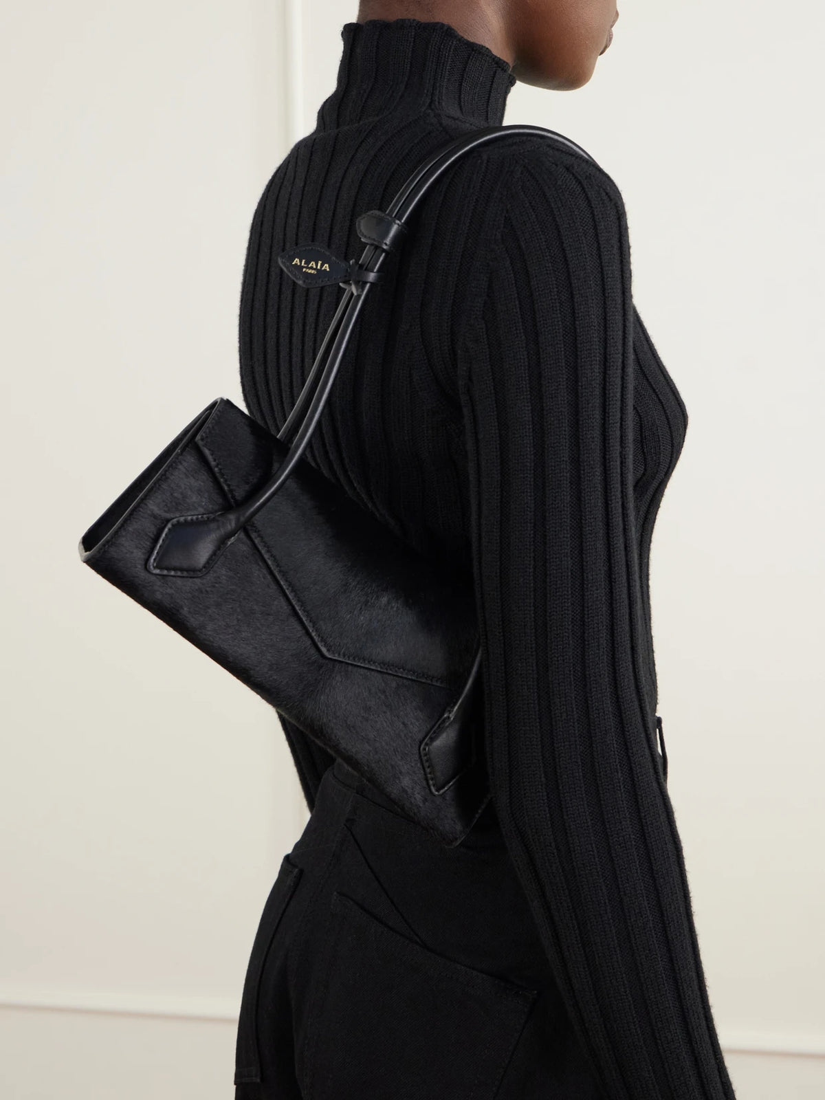 Image of Bags. Product name - Le Teckel Flap Small Leather-trimmed Calf Hair Shoulder Bag in Black colour by brand - Alaïa
