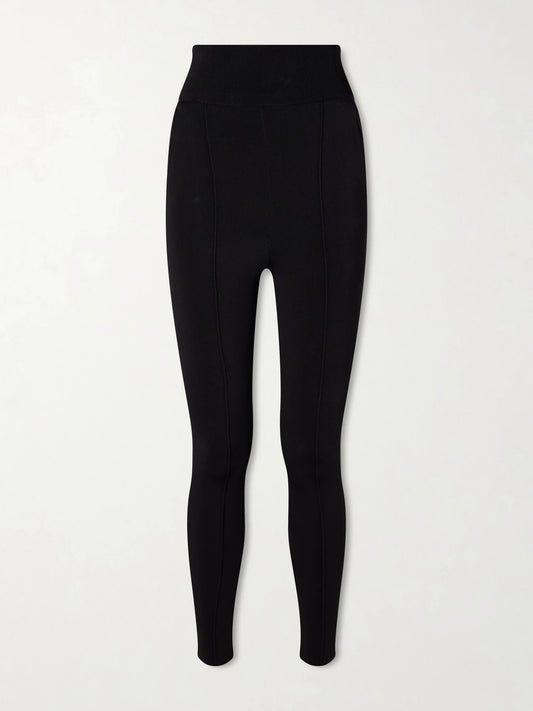 Image of a model wearing Pants. Product name - Paneled Stretch-knit Leggings in Black colour by brand - Chloé