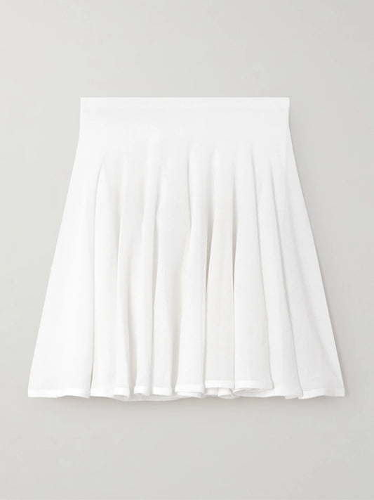 Image of a model wearing Skirts. Product name - Pleated Jersey Mini Skirt in White colour by brand - Alaïa