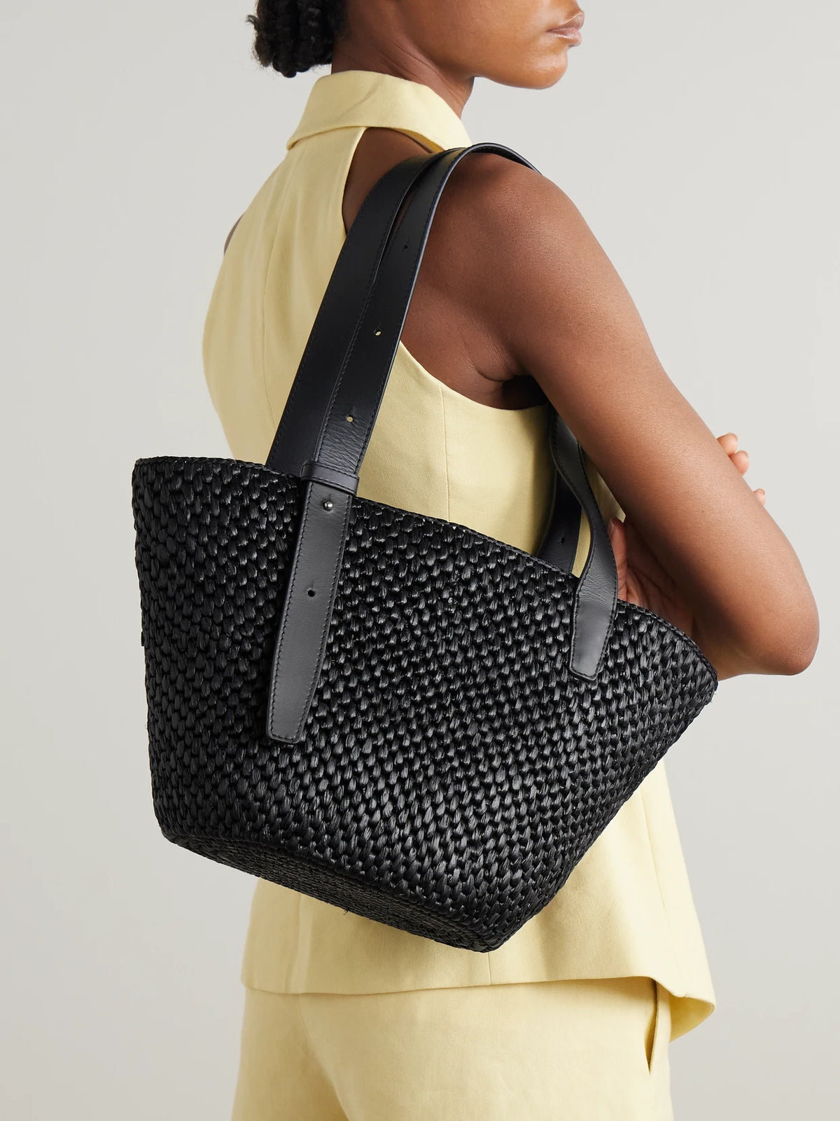 Image of Bags. Product name - The Bianca Small Leather-trimmed Raffia Tote in Black colour by brand - LIÉ STUDIO