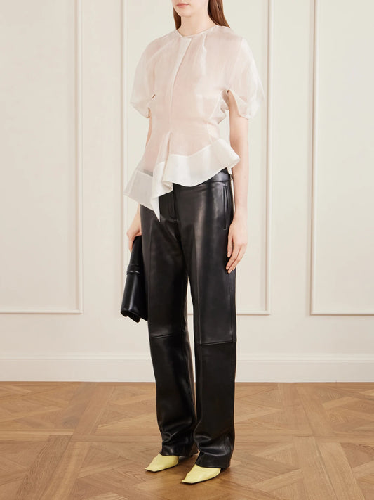 Image of a model wearing Tops. Product name - Rumi Silk Organza Top in White colour by brand - KHAITE