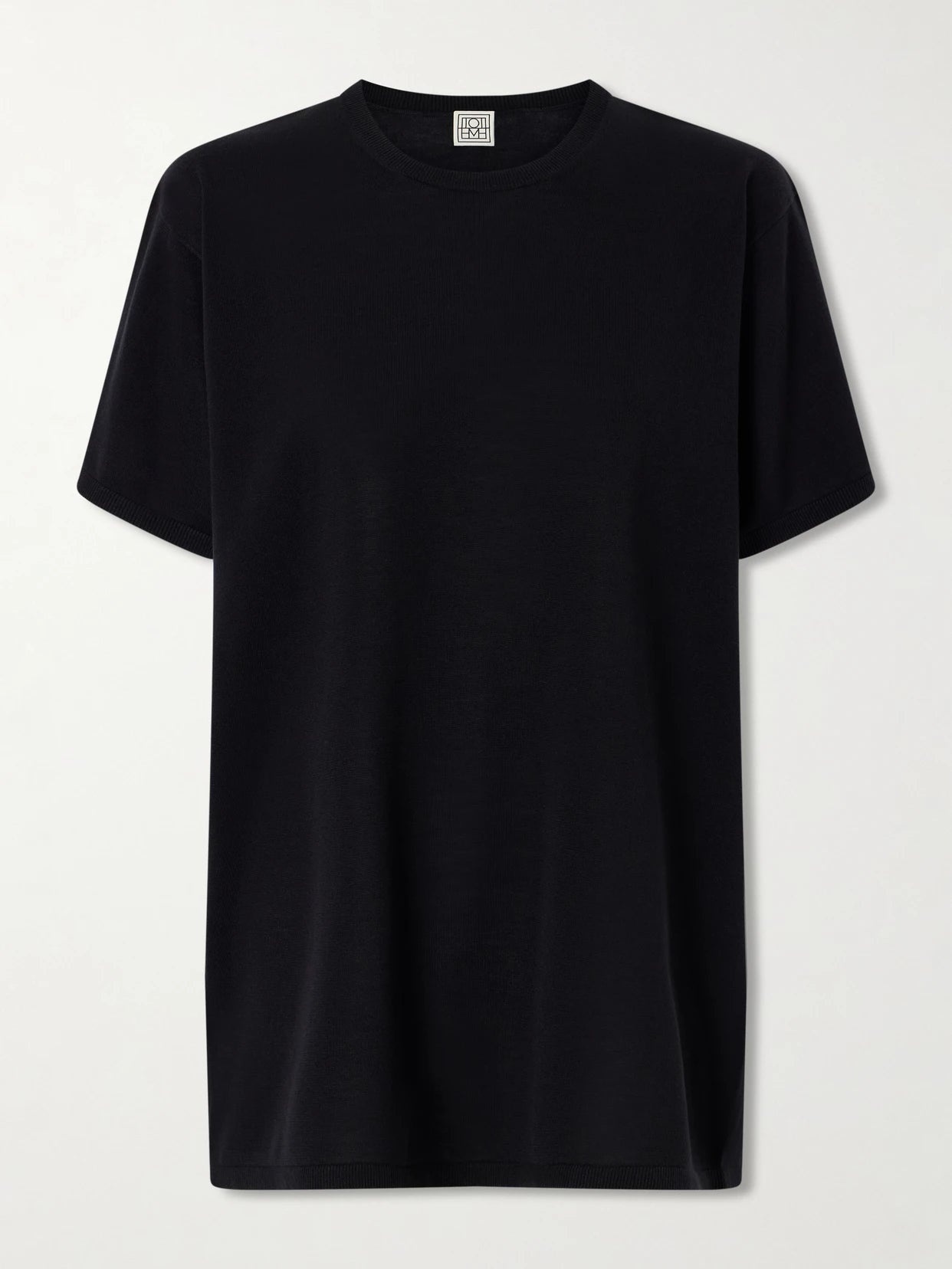 Image of a model wearing Tops. Product name - Lyocell And Cashmere-blend T-shirt in Black colour by brand - TOTEME