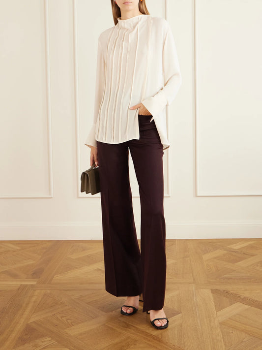 Image of a model wearing Tops. Product name - Pleated Georgette Blouse in Cream colour by brand - Victoria Beckham