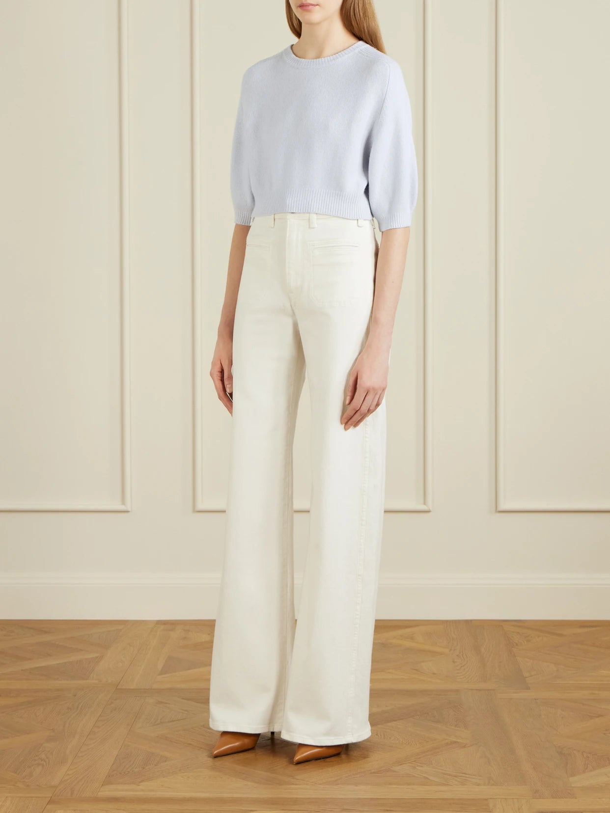 Image of a model wearing Outerwear. Product name - Lorelai Cropped Wool And Cashmere-blend Sweater in Light blue colour by brand - KHAITE