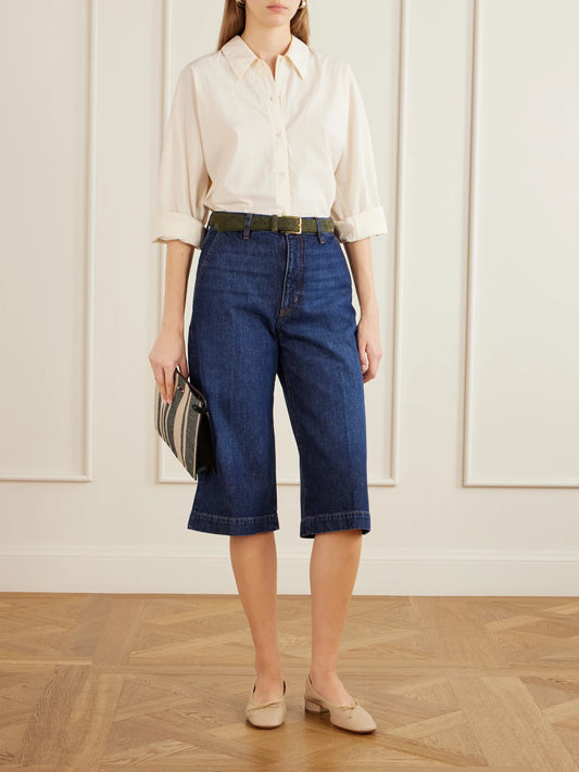 Image of a model wearing Shorts. Product name - The Culotte Knee-length Shorts in Dark denim colour by brand - FRAME