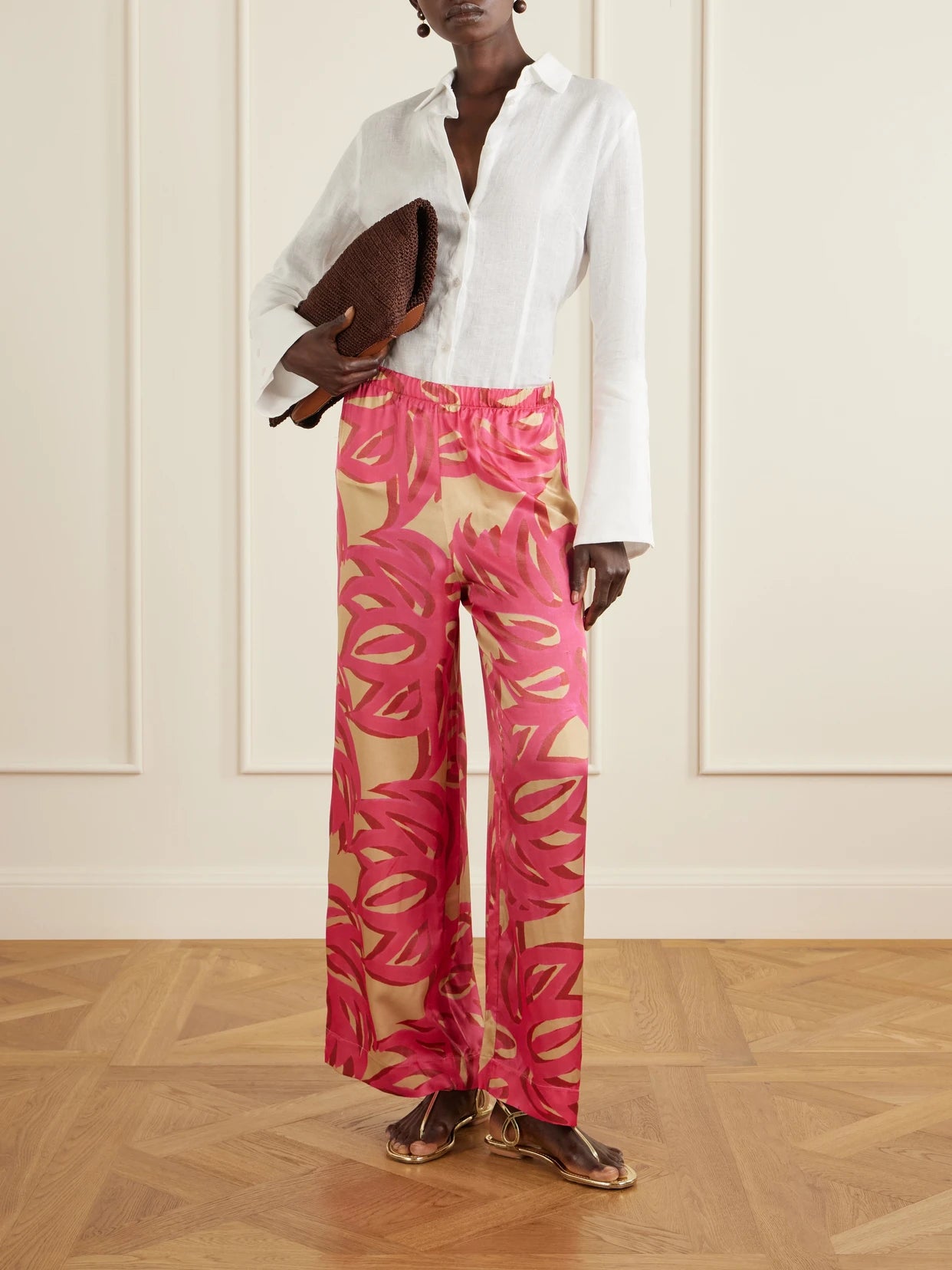 Image of a model wearing Pants. Product name - Ismene Wide-leg Silk-blend Pants in Pink colour by brand - Themis Z