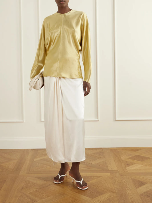 Image of a model wearing Tops. Product name - Sylvie Satin Blouse in Gold colour by brand - FFORME